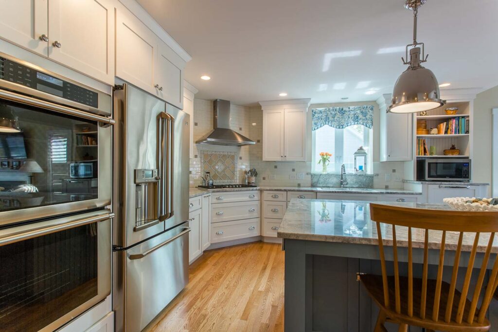 Timeless stainless steel appliances compliment this bright and elegant kitchen